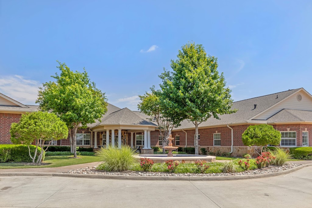 the front of a home with a driveway and landscaping