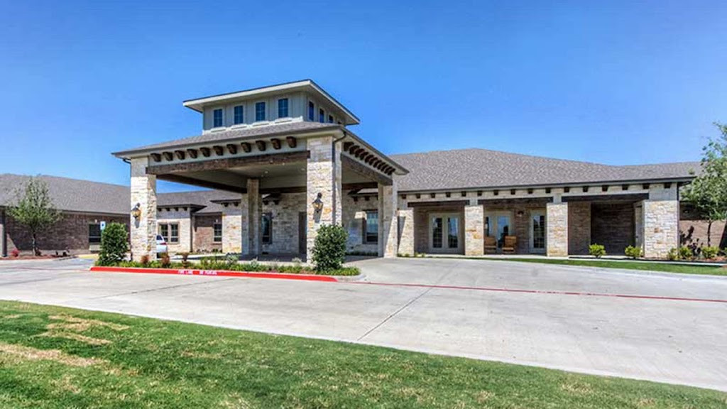 the front of a home with a large driveway