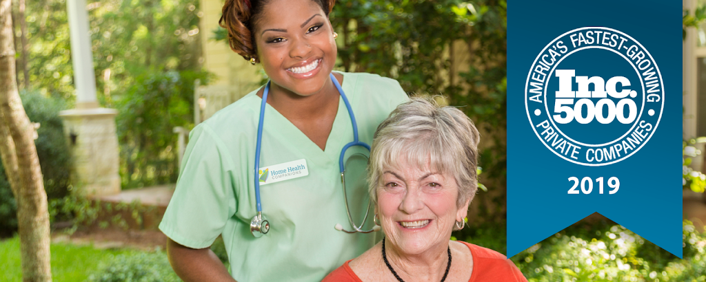 a woman in a green scrub suit and a nurse