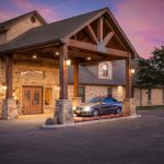 a car parked in front of a stone building