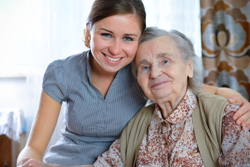 a woman hugging her grandmother