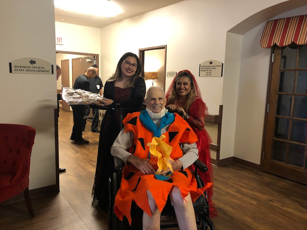 a woman in a wheelchair holding a child