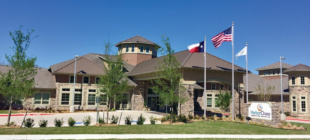 the front of a building with a flag flying in the air