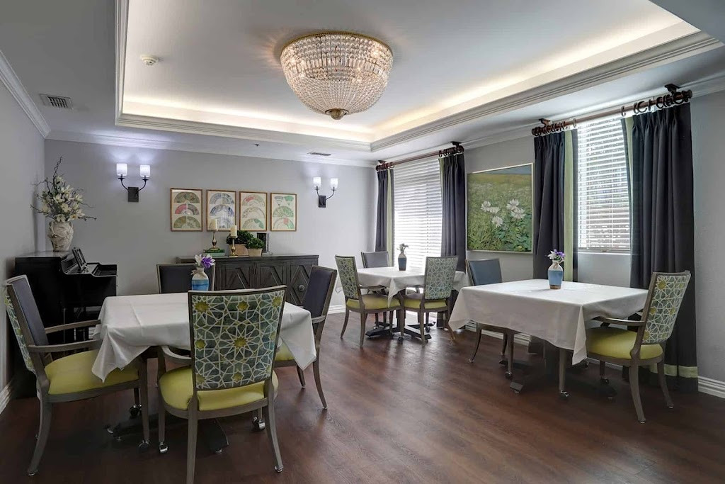 a dining room with a table and chairs
