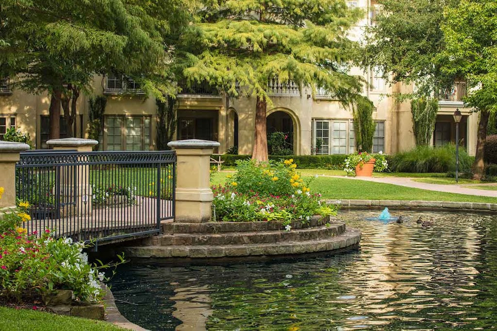 a pond in front of a house