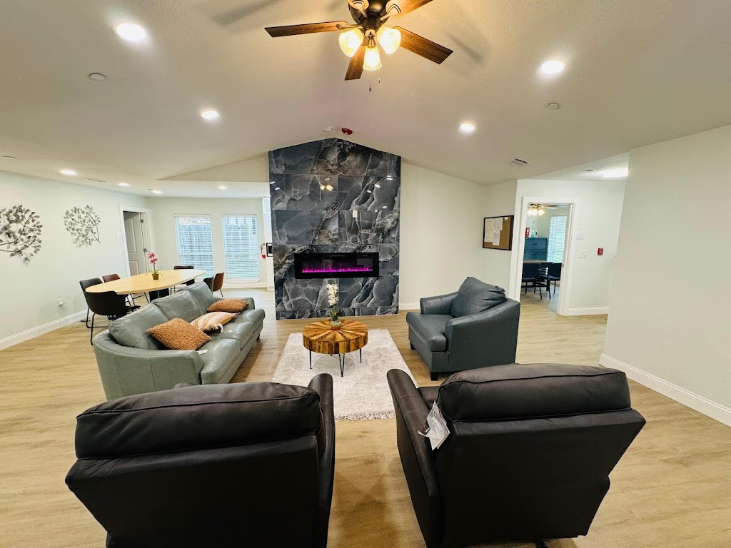 a living room with couches and a fireplace