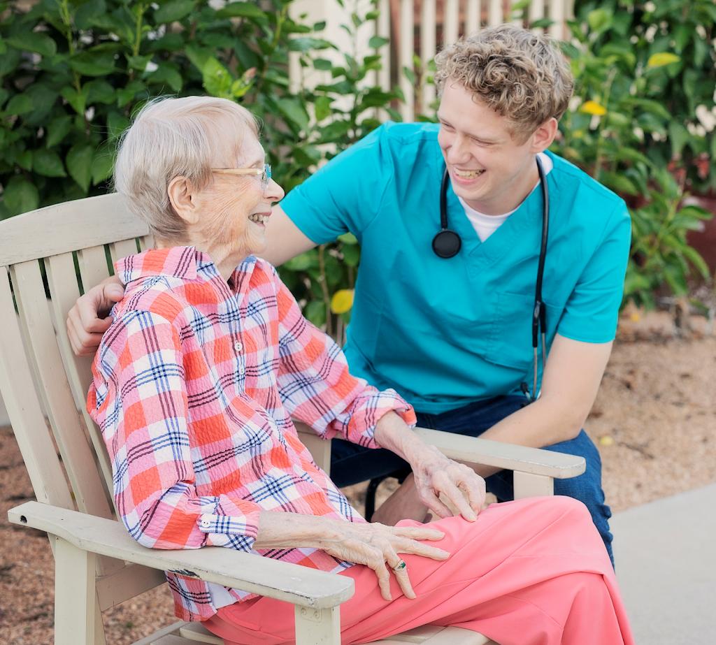 a woman sitting on a bench with a doctor