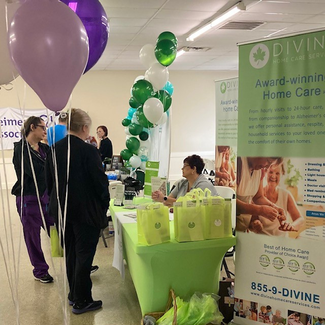 a table with balloons and a sign that says, ' give '
