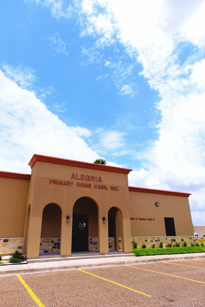 the front of a building with a blue sky in the background