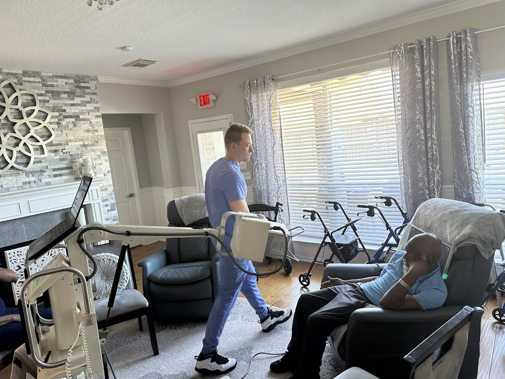 a man in a wheelchair with a walker in a living room