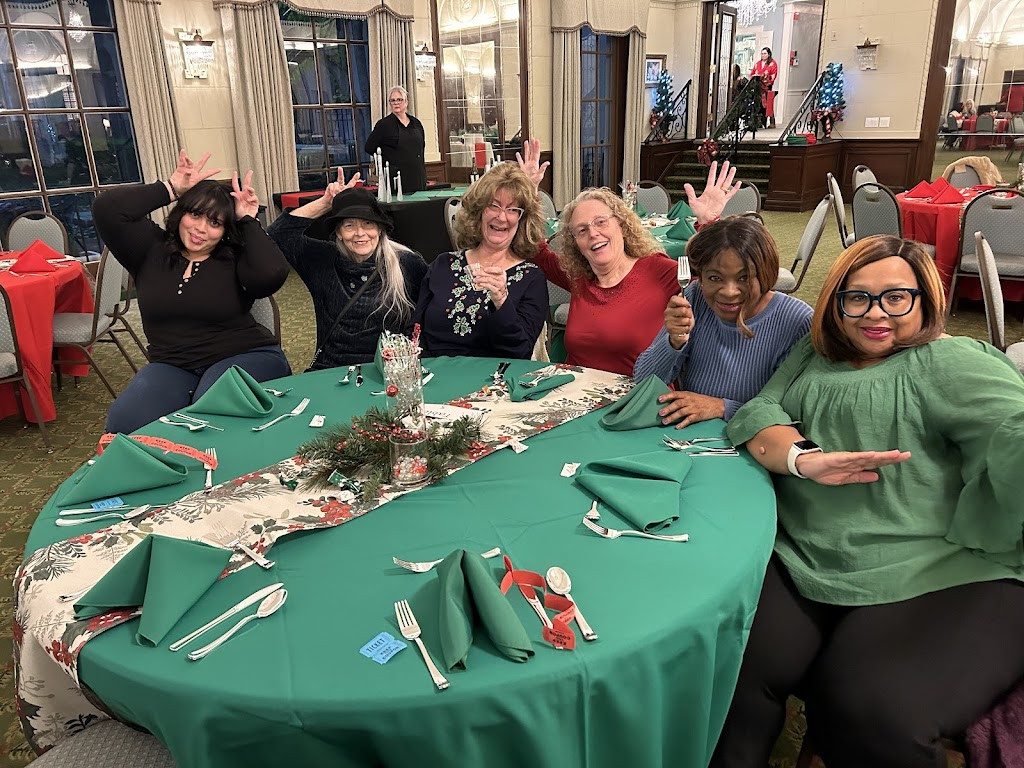 a group of people sitting around a table