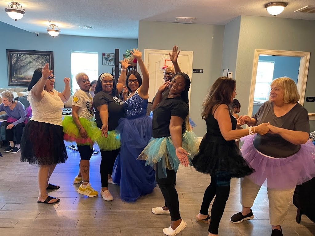 a group of women dancing in a room