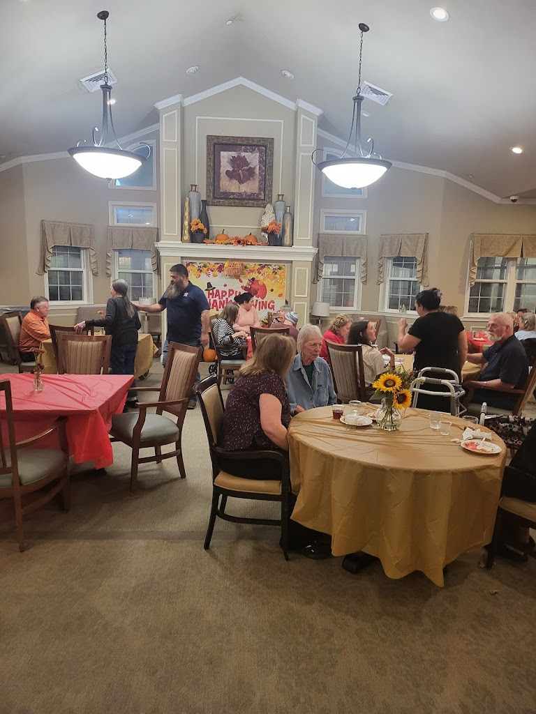 a group of people sitting around a table